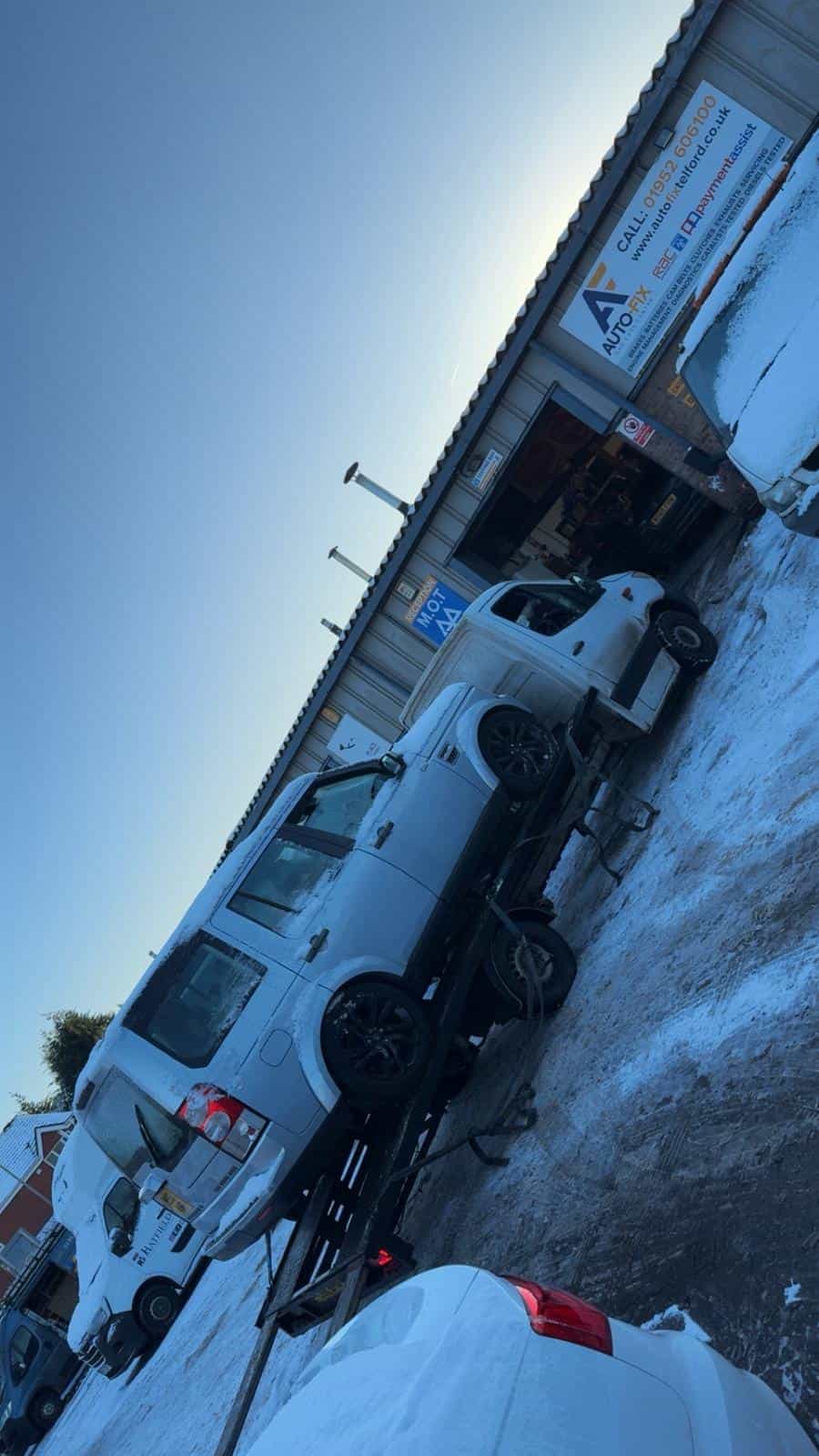 Recovery trucks at Telford & Wrekin Recovery yard in snowy weather.