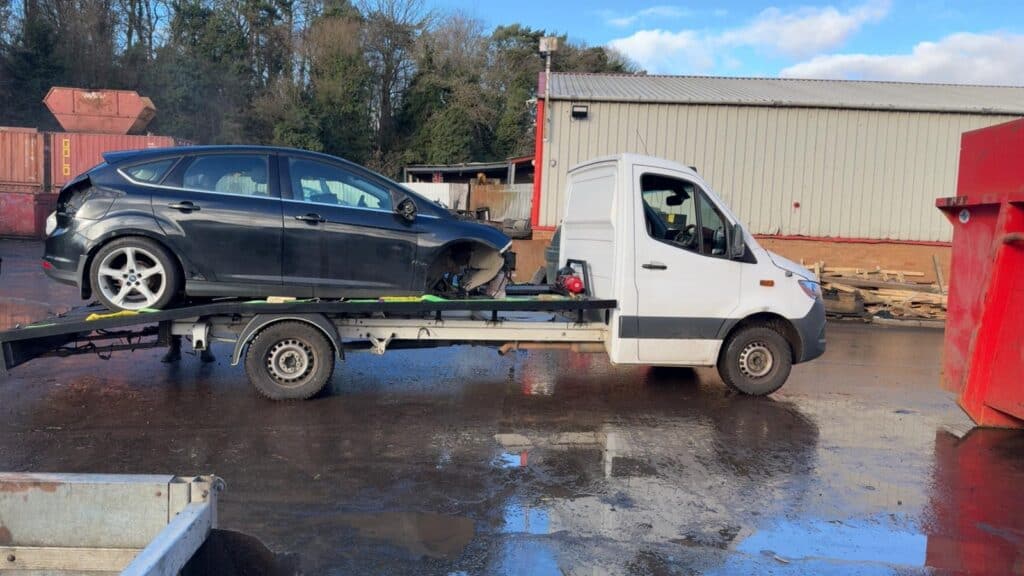 Telford & Wrekin Recovery tow truck transporting a black car.