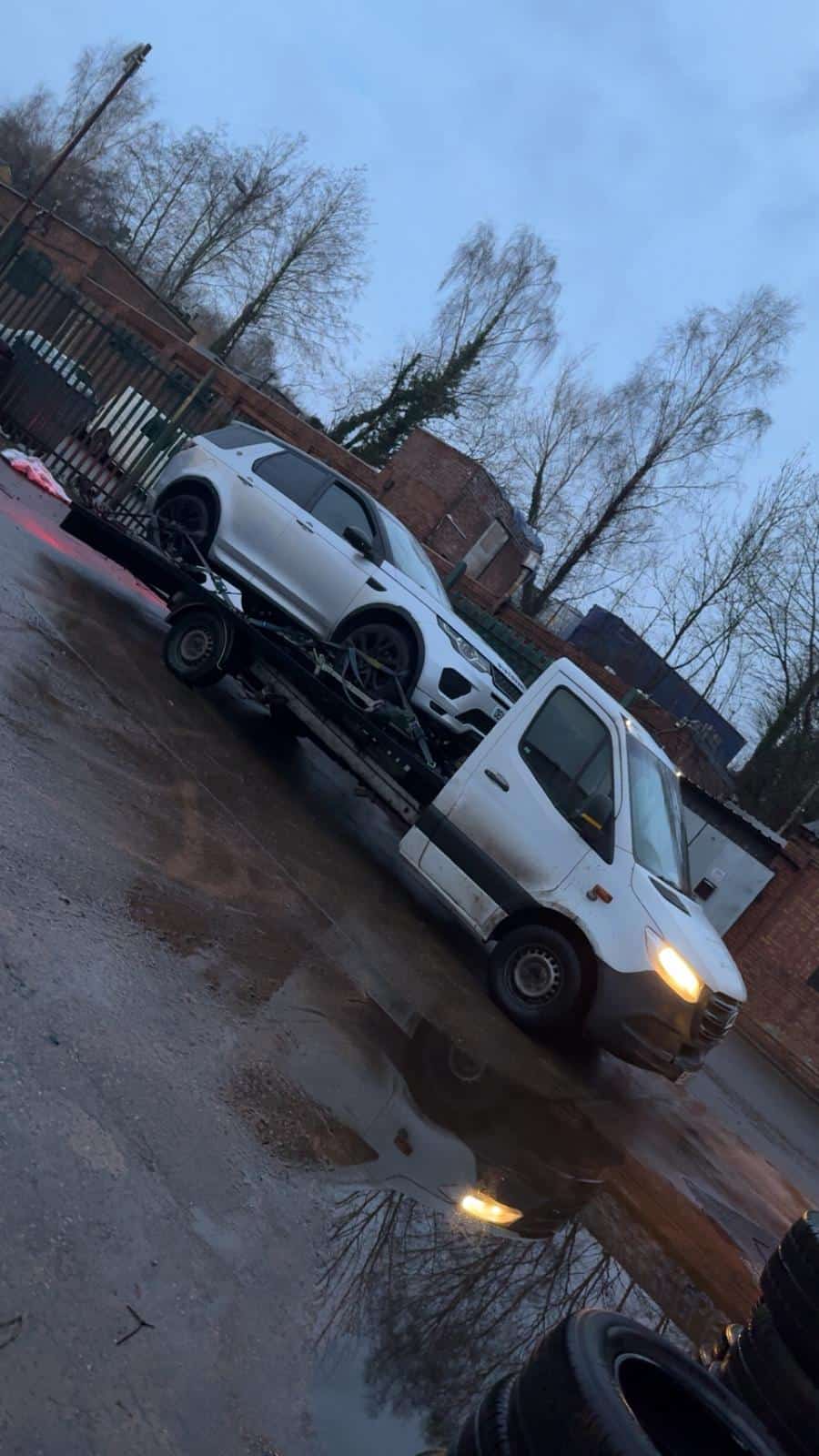 Telford & Wrekin Recovery tow truck on a wet road.