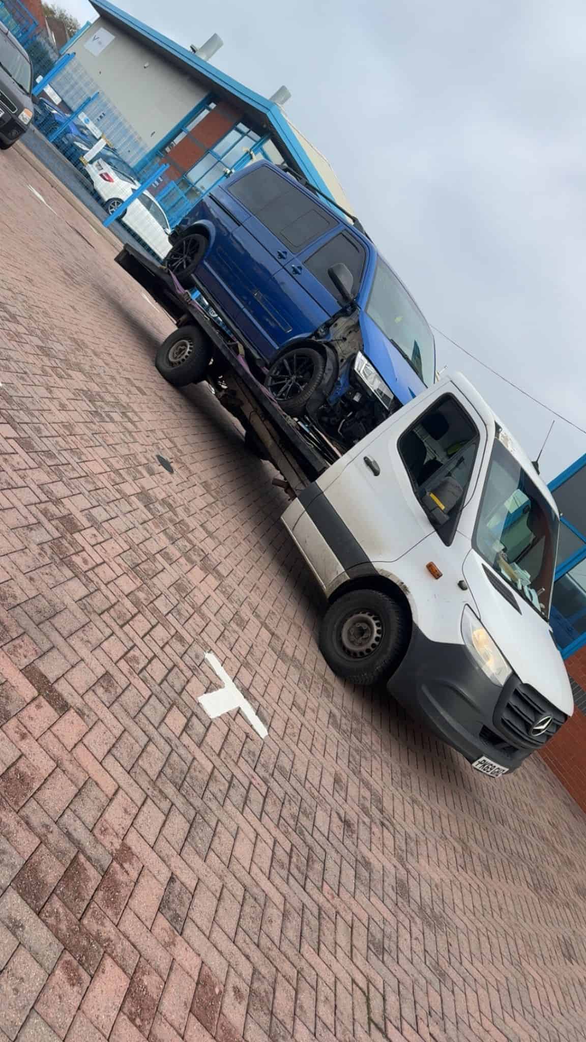 Telford & Wrekin Recovery trucks parked outside a building.